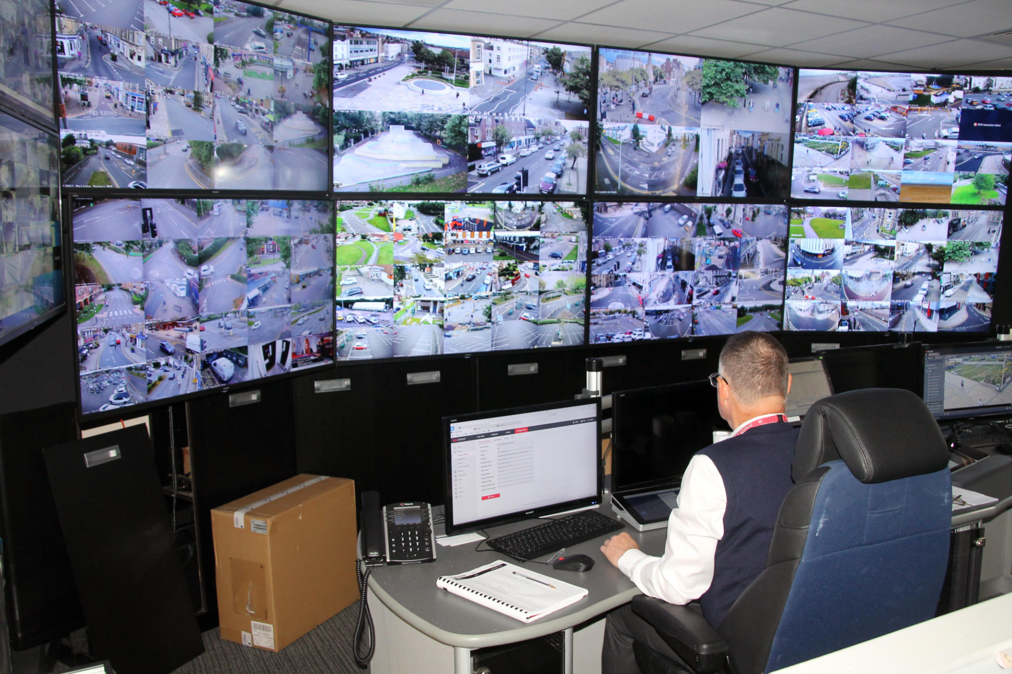 Complete command center with surveillance screen wall and operator